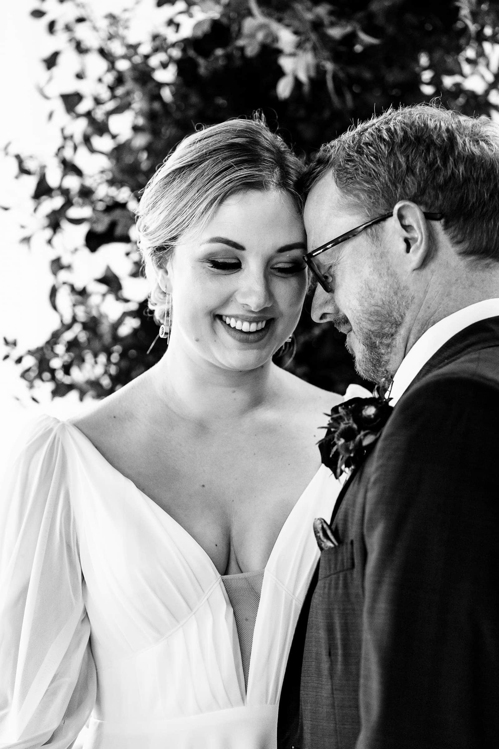 Black and White portrait of a newlywed couple at a historic Raleigh wedding venue | photos by Kivus & Camera