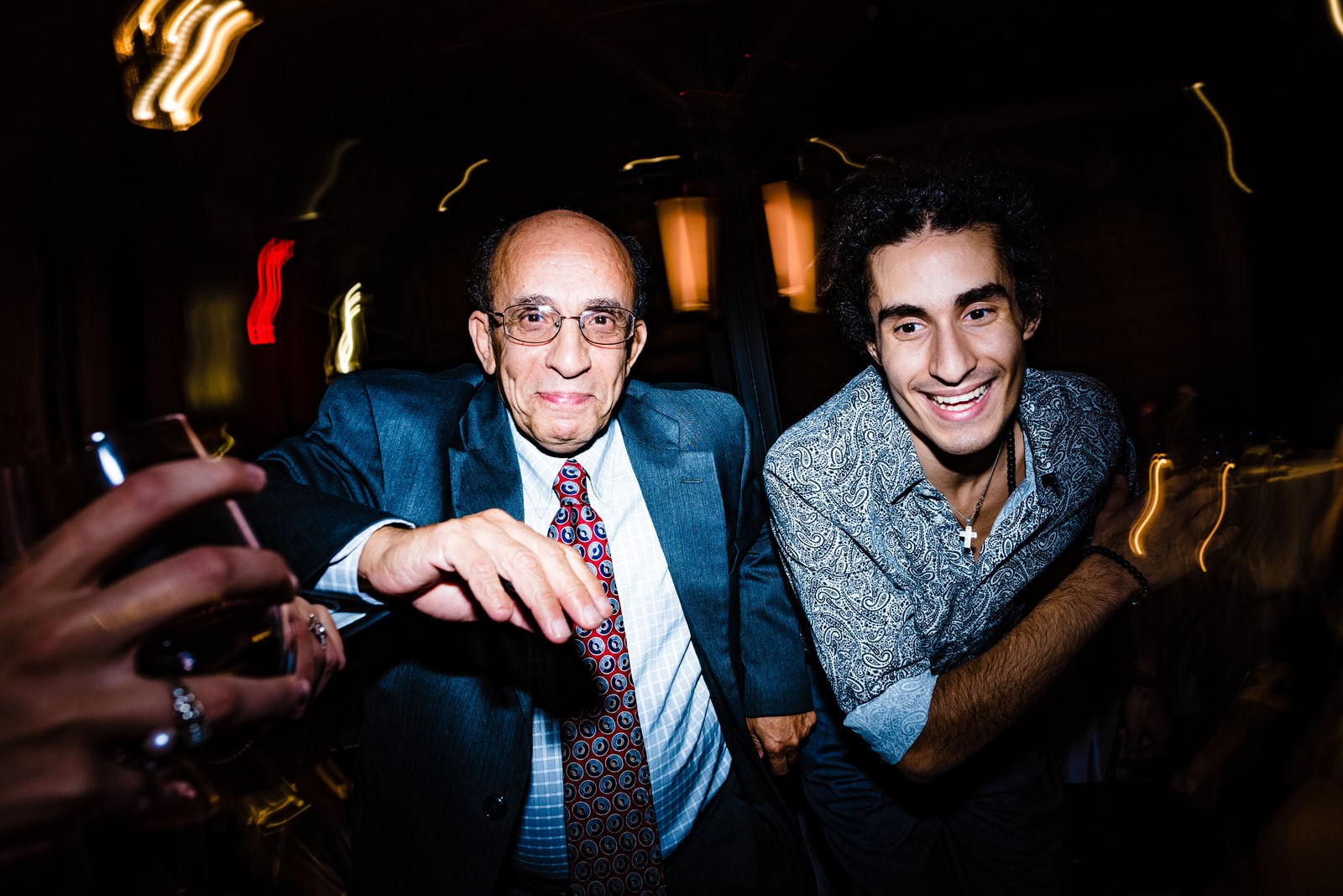 Wedding guests dance at a wedding reception at the Rickhouse in Durham, NC
