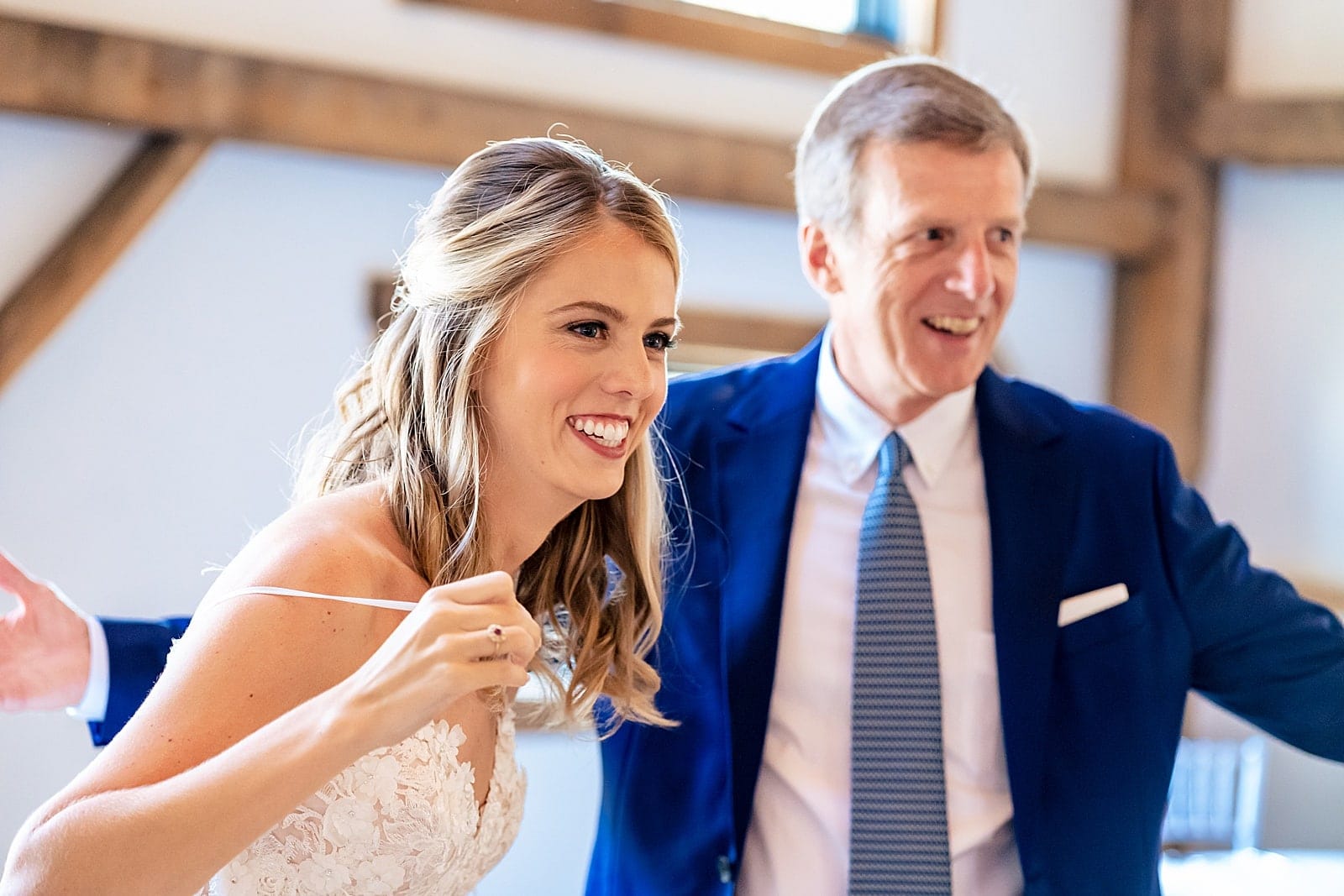 oops! This bride's strap broke when she hugged her dad at their first look. Luckily a safety pin saved the day