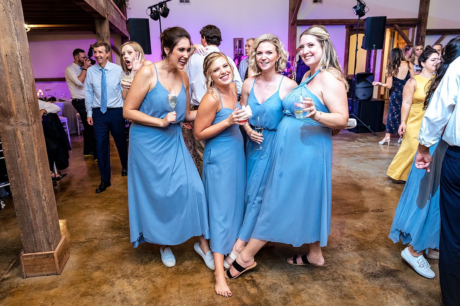 these bridesmaids trimmed off the hems of their dresses at the reception to make the dancing easier!