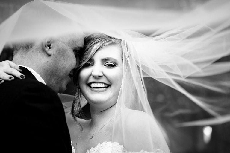 If you're wearing a veil on your wedding day, you have to get veil photos