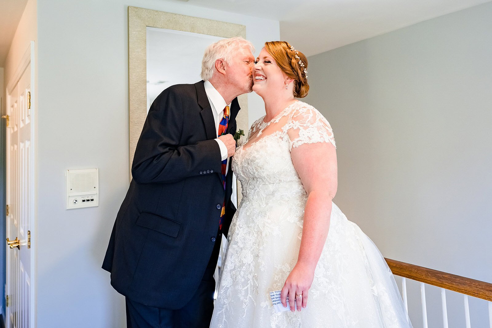 Father of the bride comes to see her before walking her down the aisle