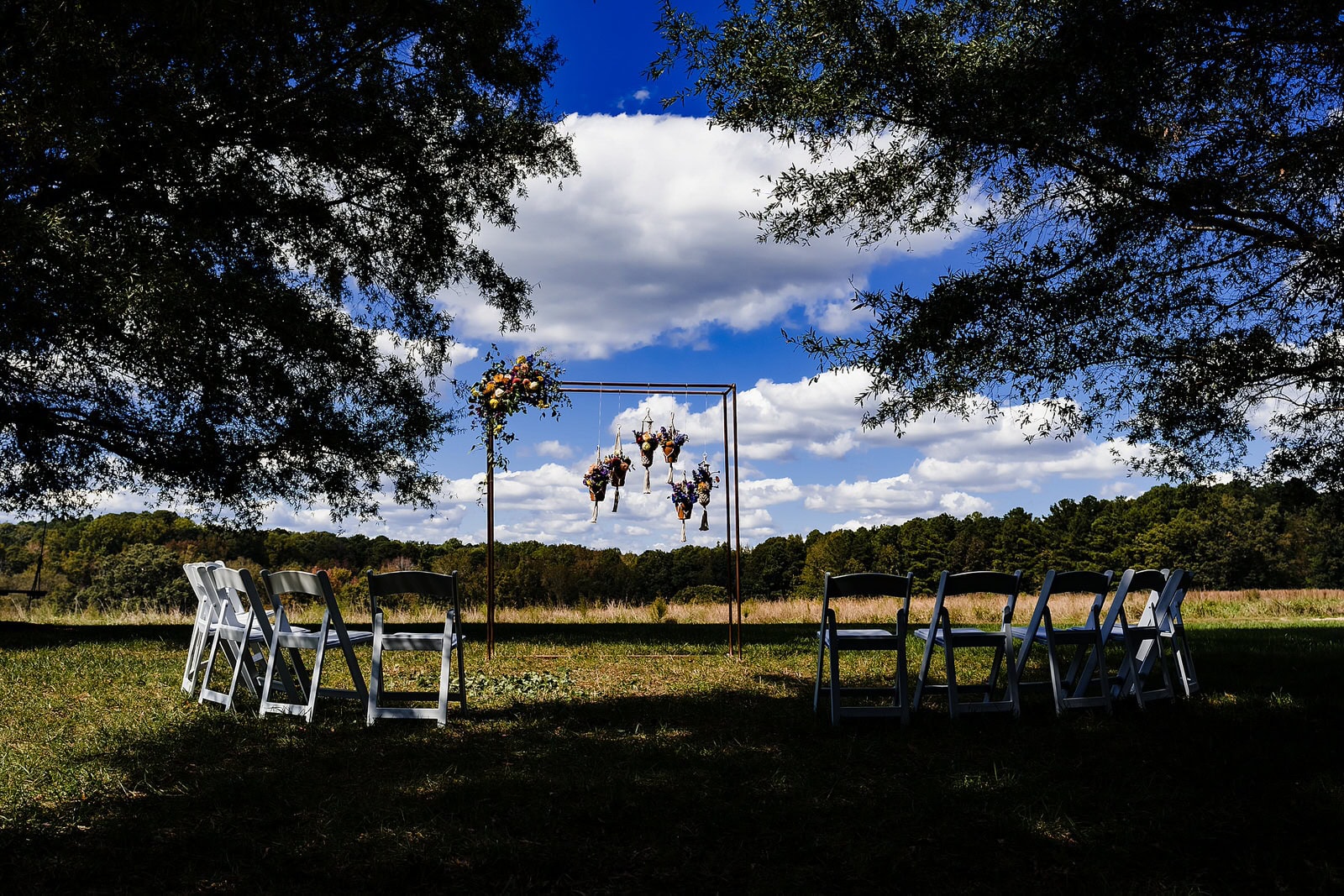 Beautiful outdoor wedding ceremony setup at the Meadows Raleigh