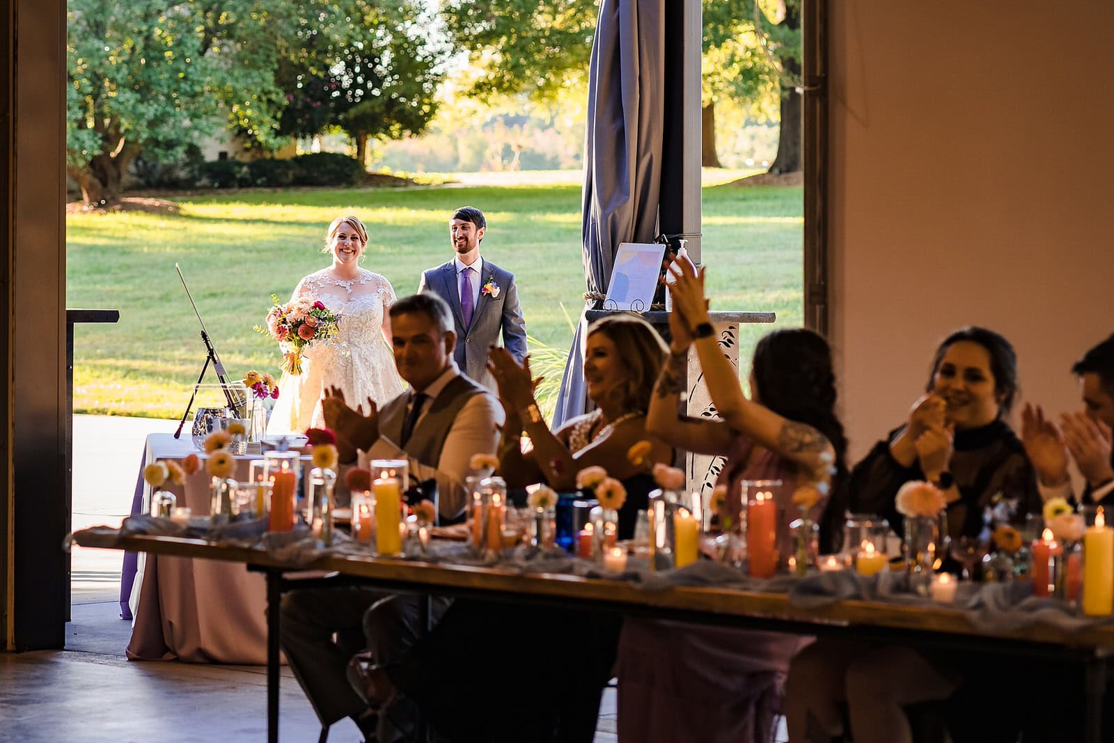 Bride and groom enter their reception at the Meadows Raleigh