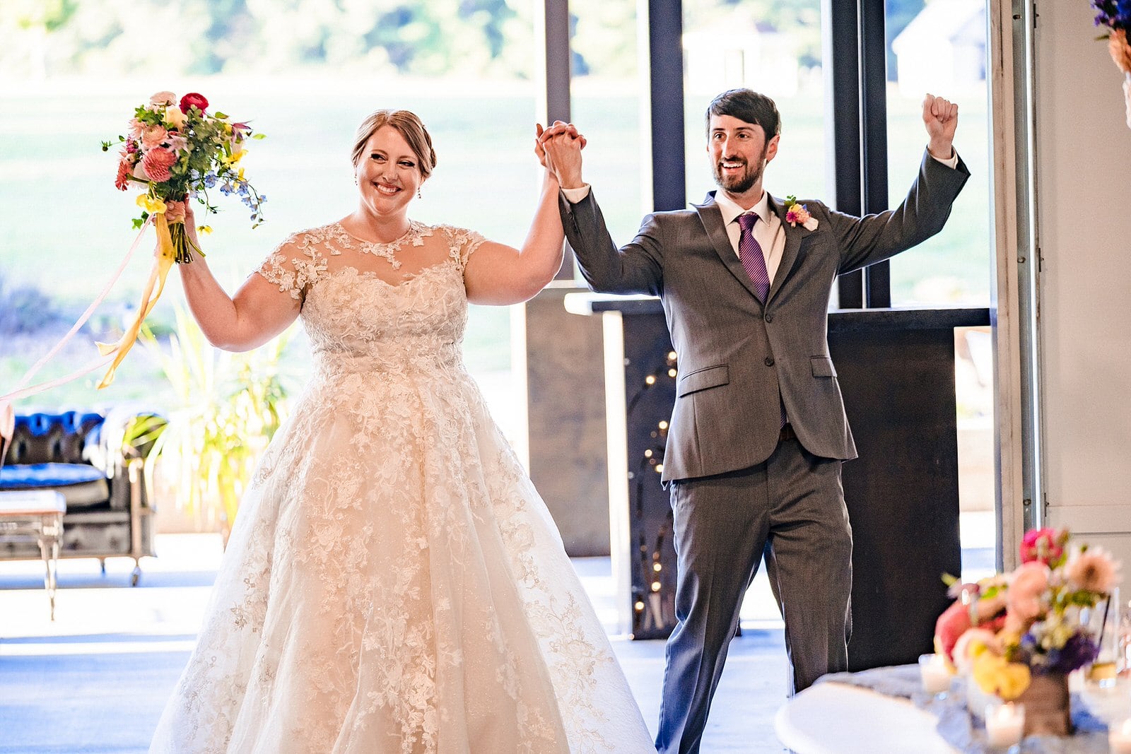 Bride and groom enter their wedding reception