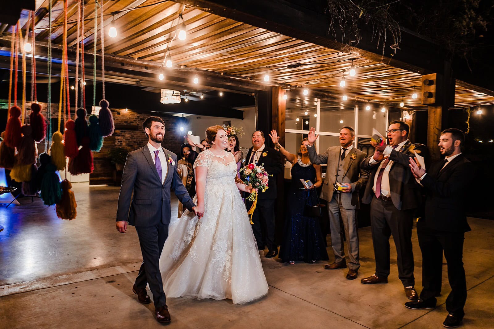 Bride and groom exit their Meadows Raleigh wedding