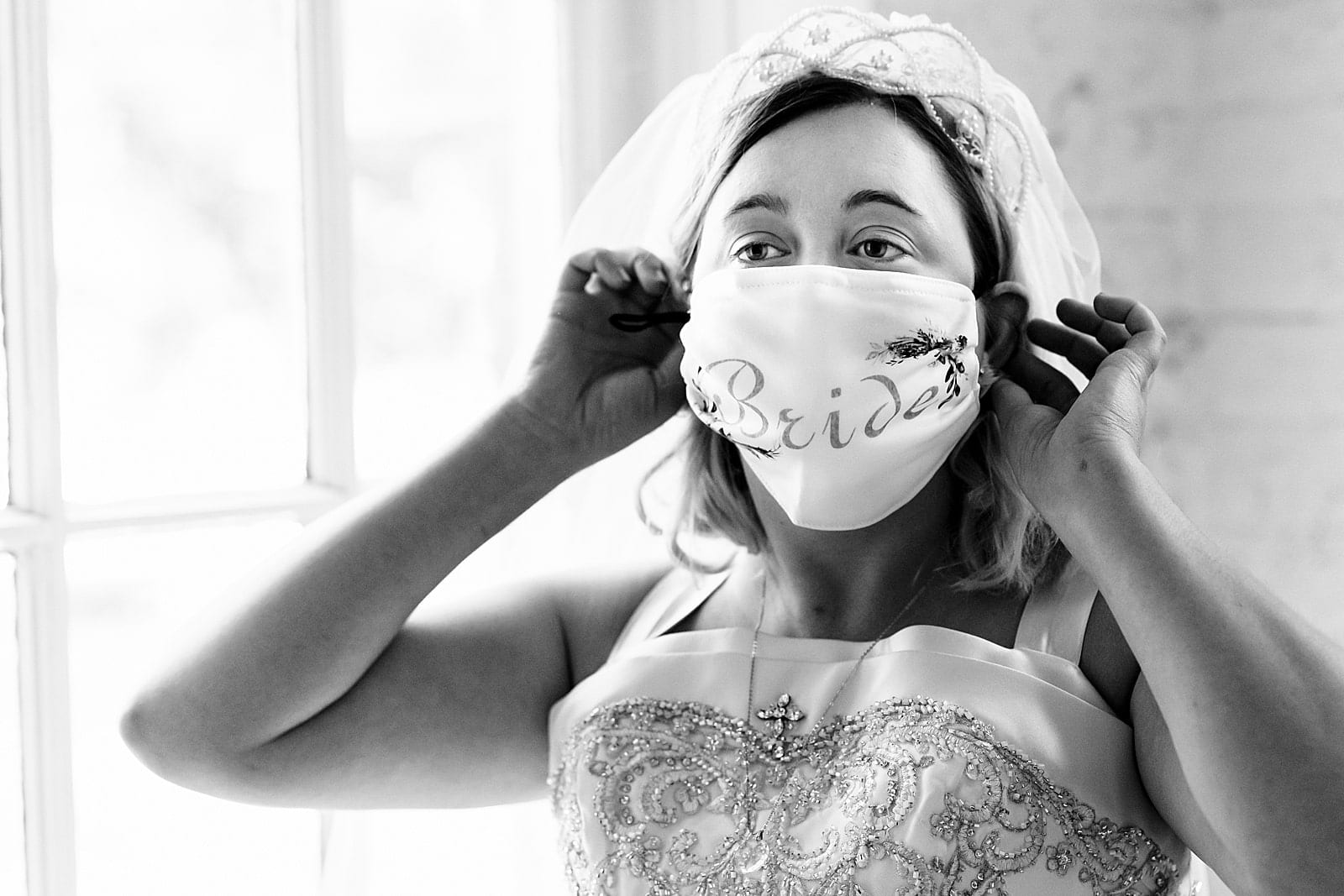 bride and groom wear custom masks on their wedding day during the COVID pandemic