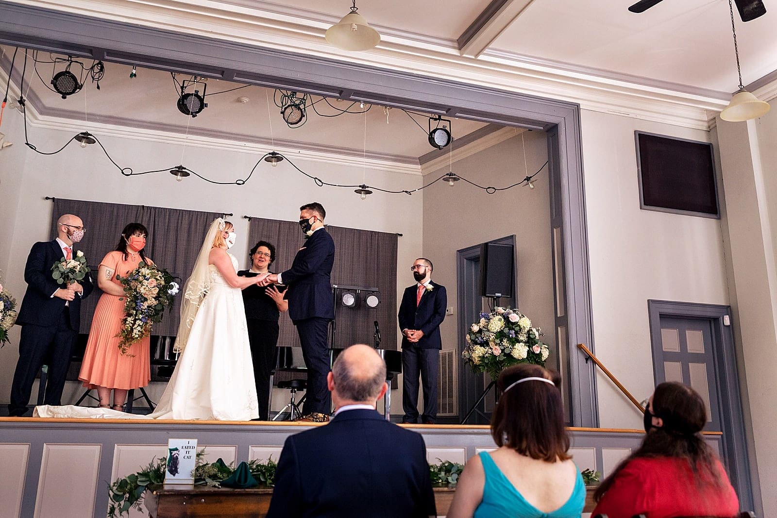 on stage wedding ceremony at old Murphey school in Durham, NC