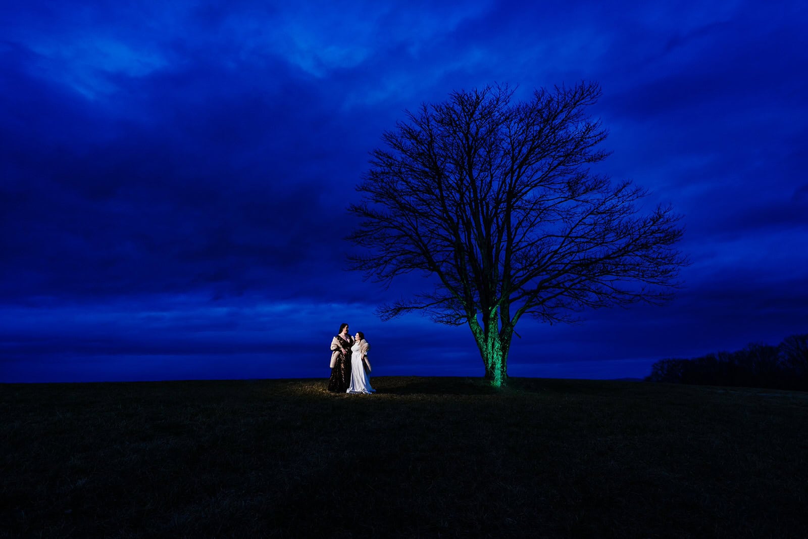 Blue hour wedding portraits with two brides in the NC mountains
