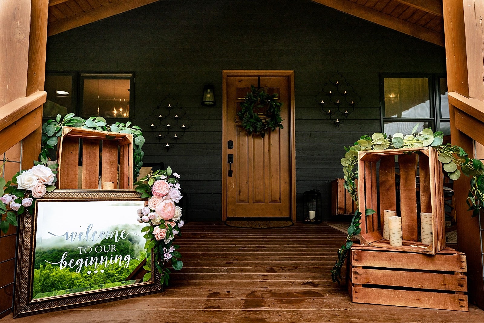 misty mountain range reflected in a wedding welcome sign