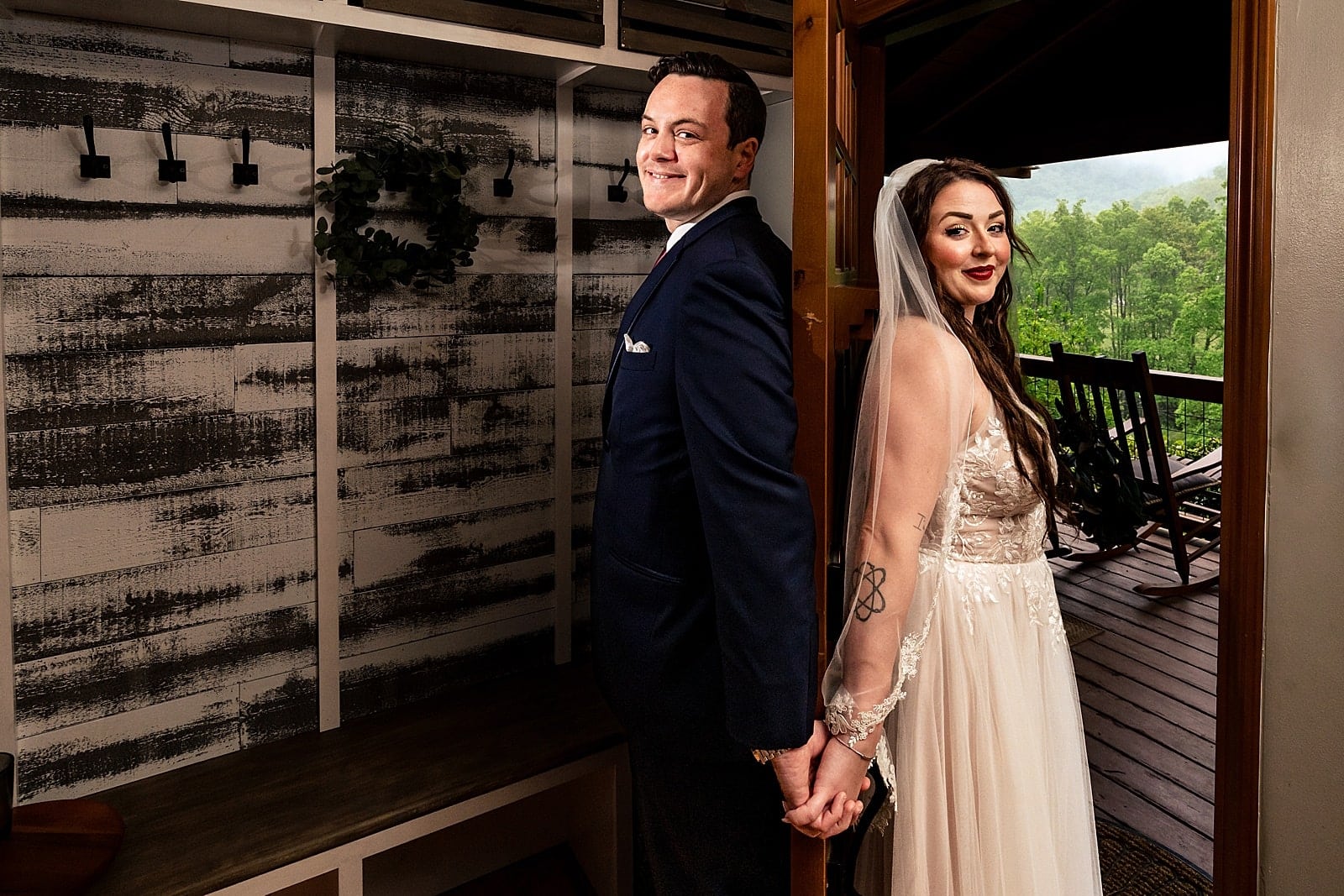 Couple's first touch at a misty mountain wedding in Asheville, NC | photos by Kivus & Camera