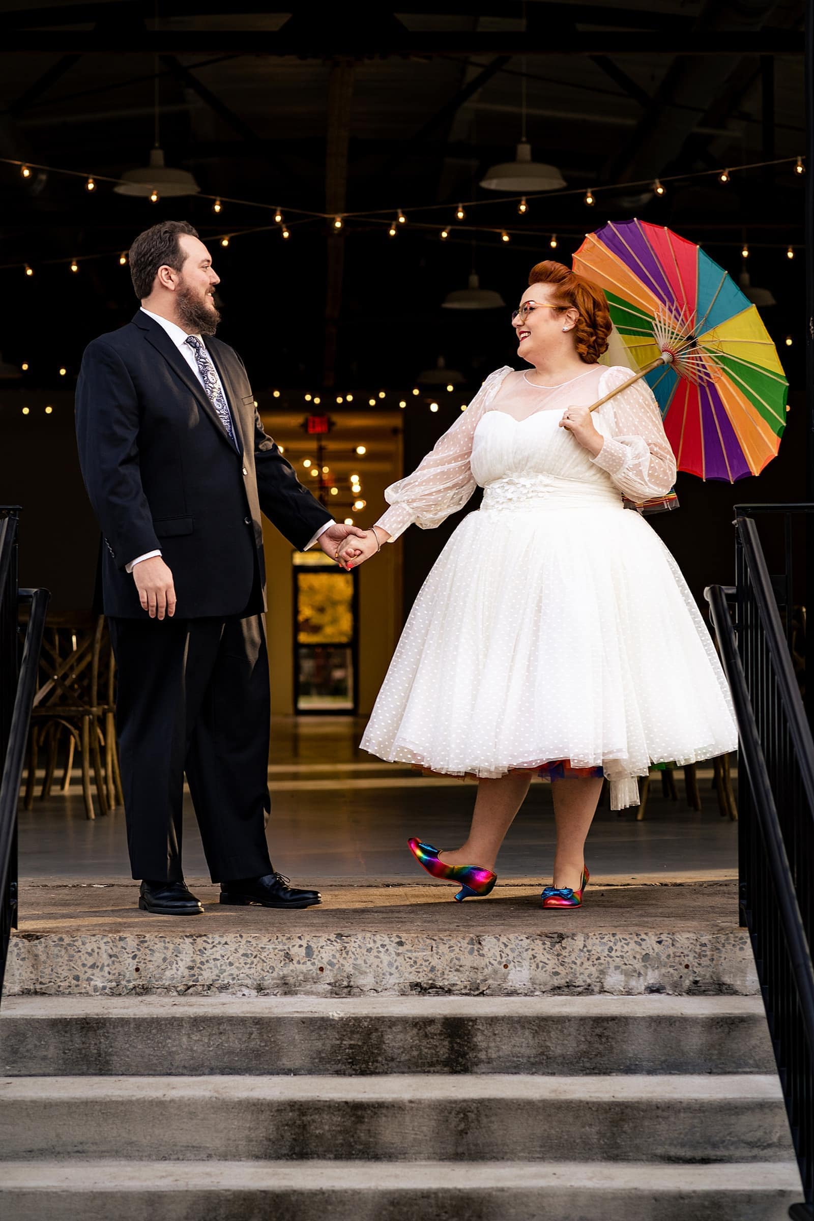 This bride had a rainbow petticoat and a rainbow parasol and a rainbow veil and she's just the best - awesome nerdy Graham Mill wedding