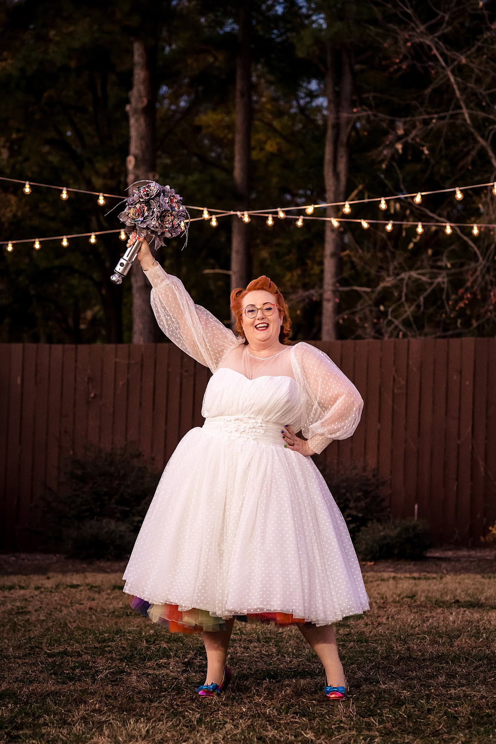This bride's bouquet had a lightsaber hilt and origami flowers made of comic book pages