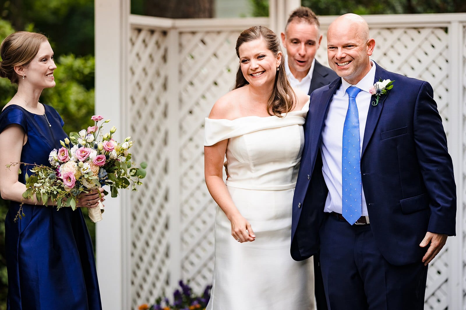 Bride and groom smile and process out of wedding ceremony at Raleigh micro-wedding