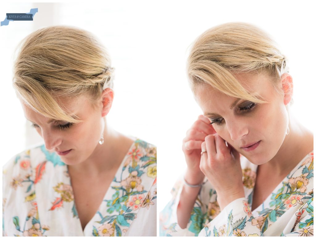 Bride putting on grandmother's earrings