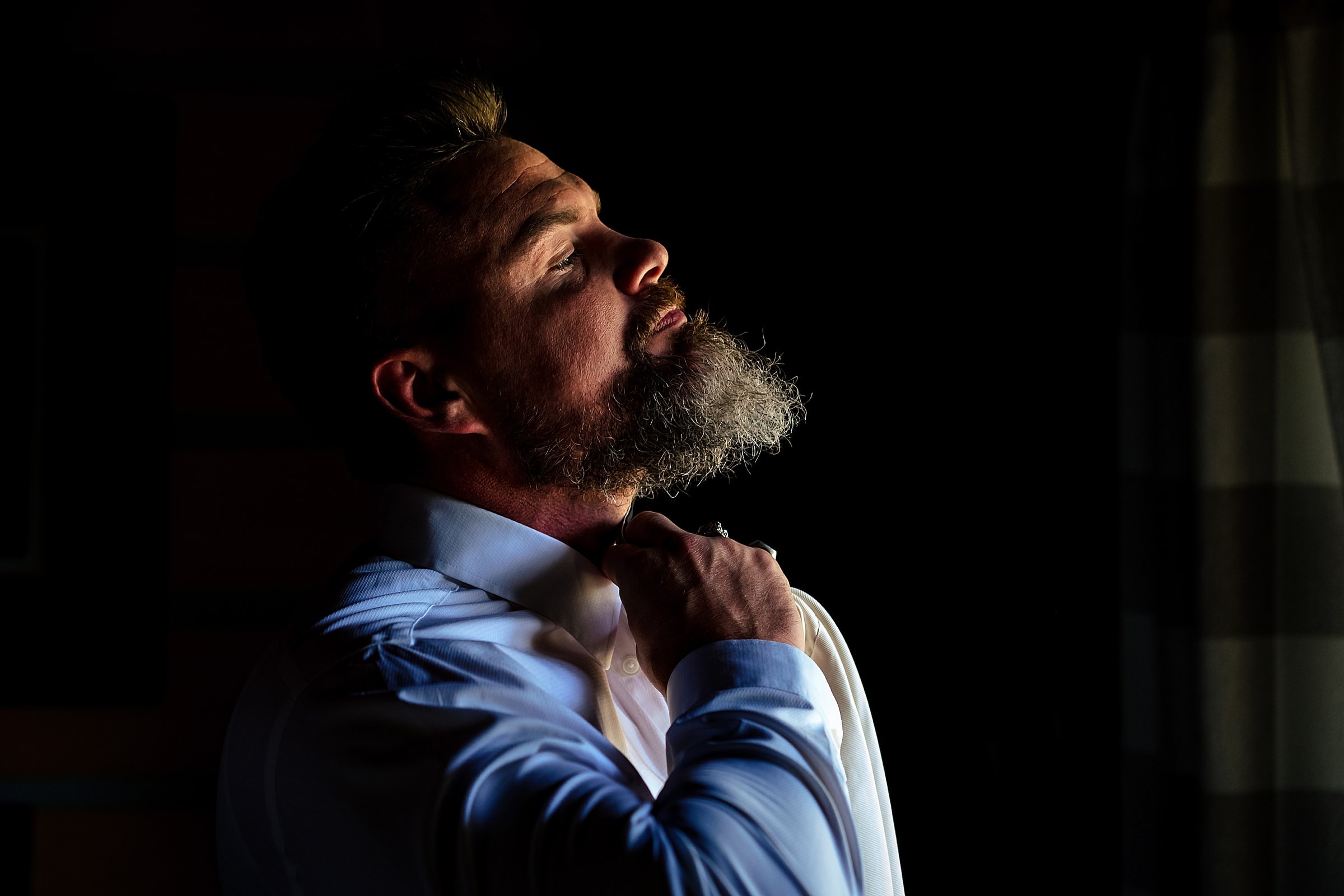 Groom gets ready at a rustic vineyard wedding in North Carolina