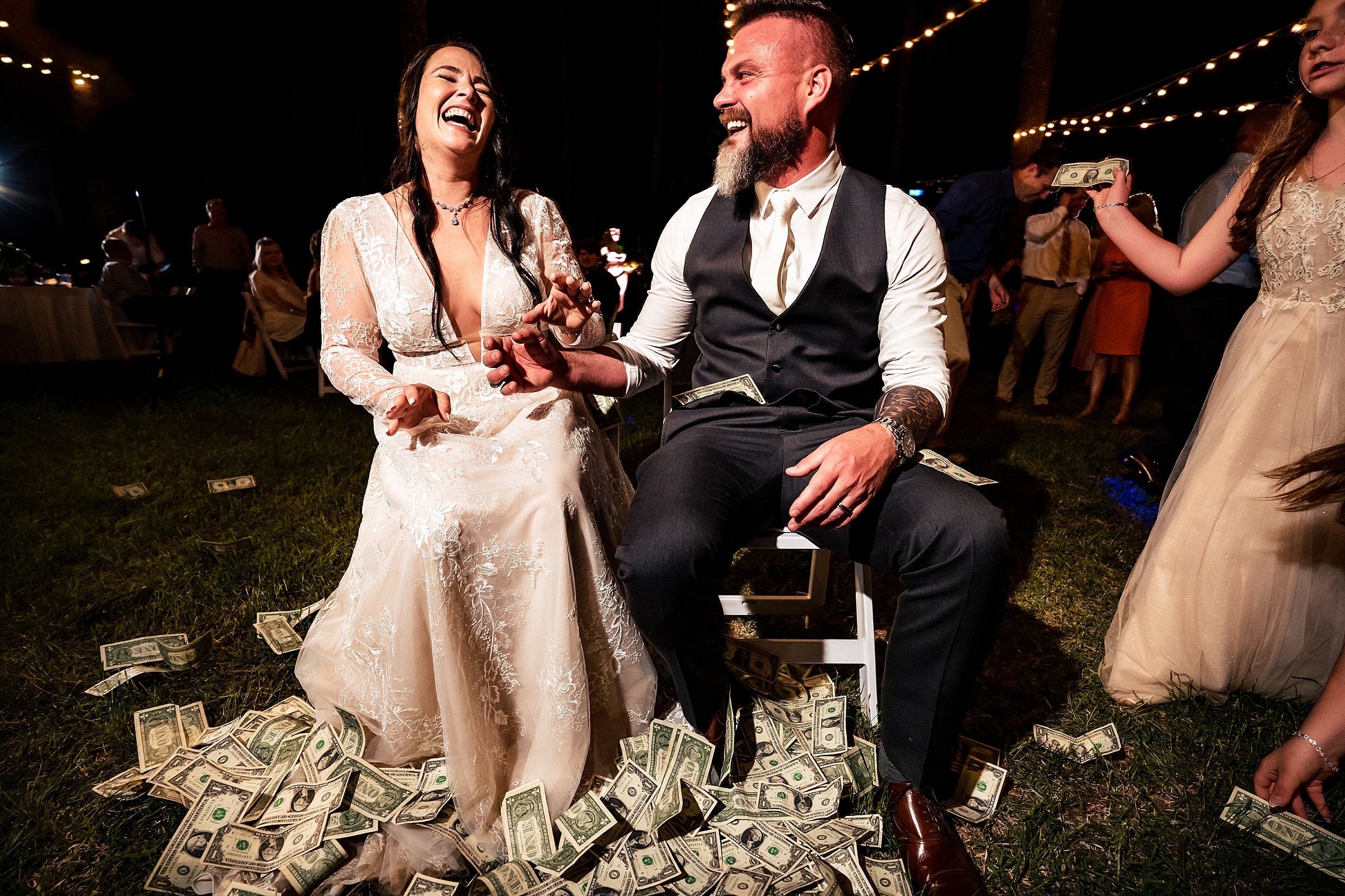 This groom's co-workers surprised the couple by making it rain dollar bills on them