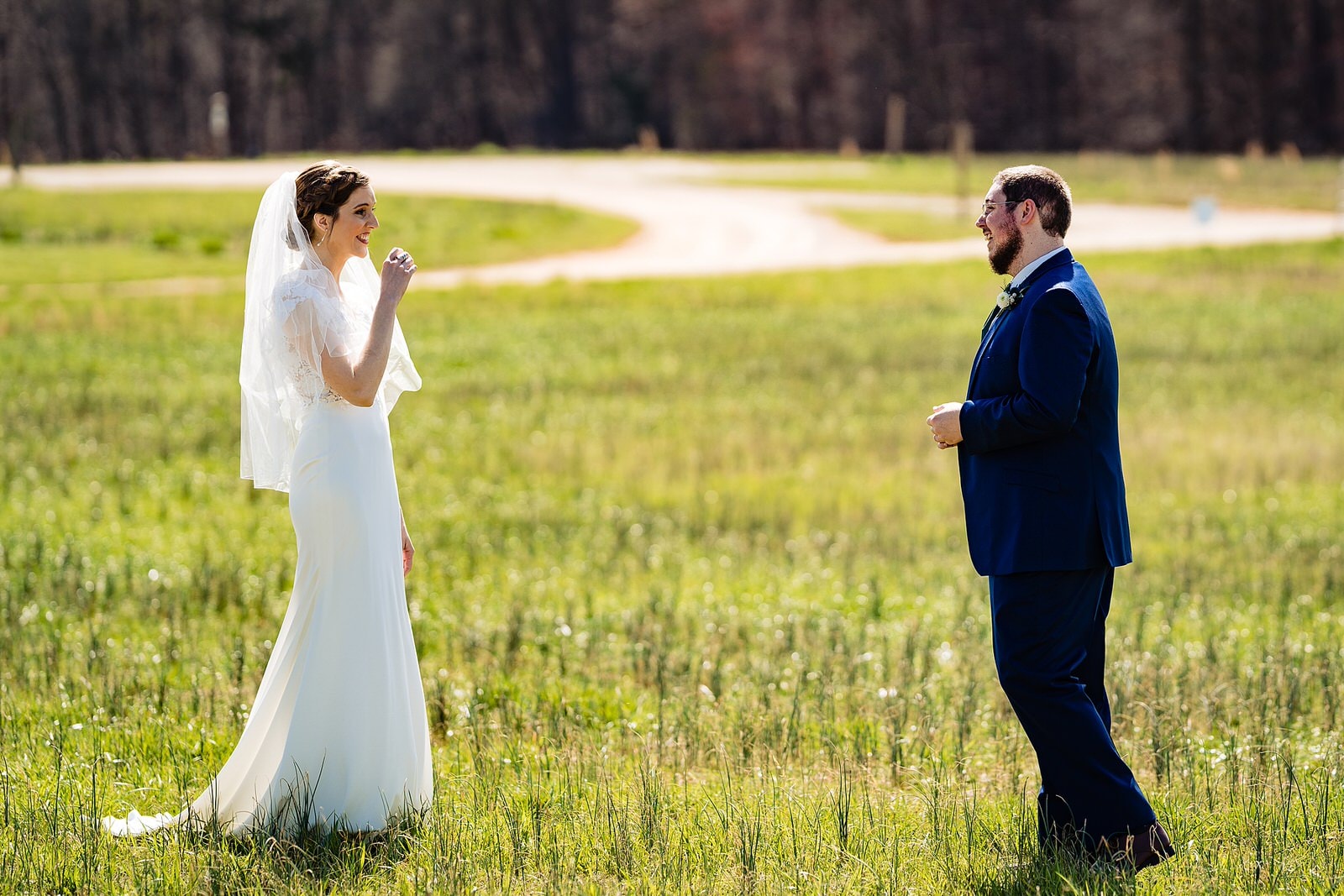 Bride and groom share a first look at The Meadows Raleigh from Raleigh wedding photographers