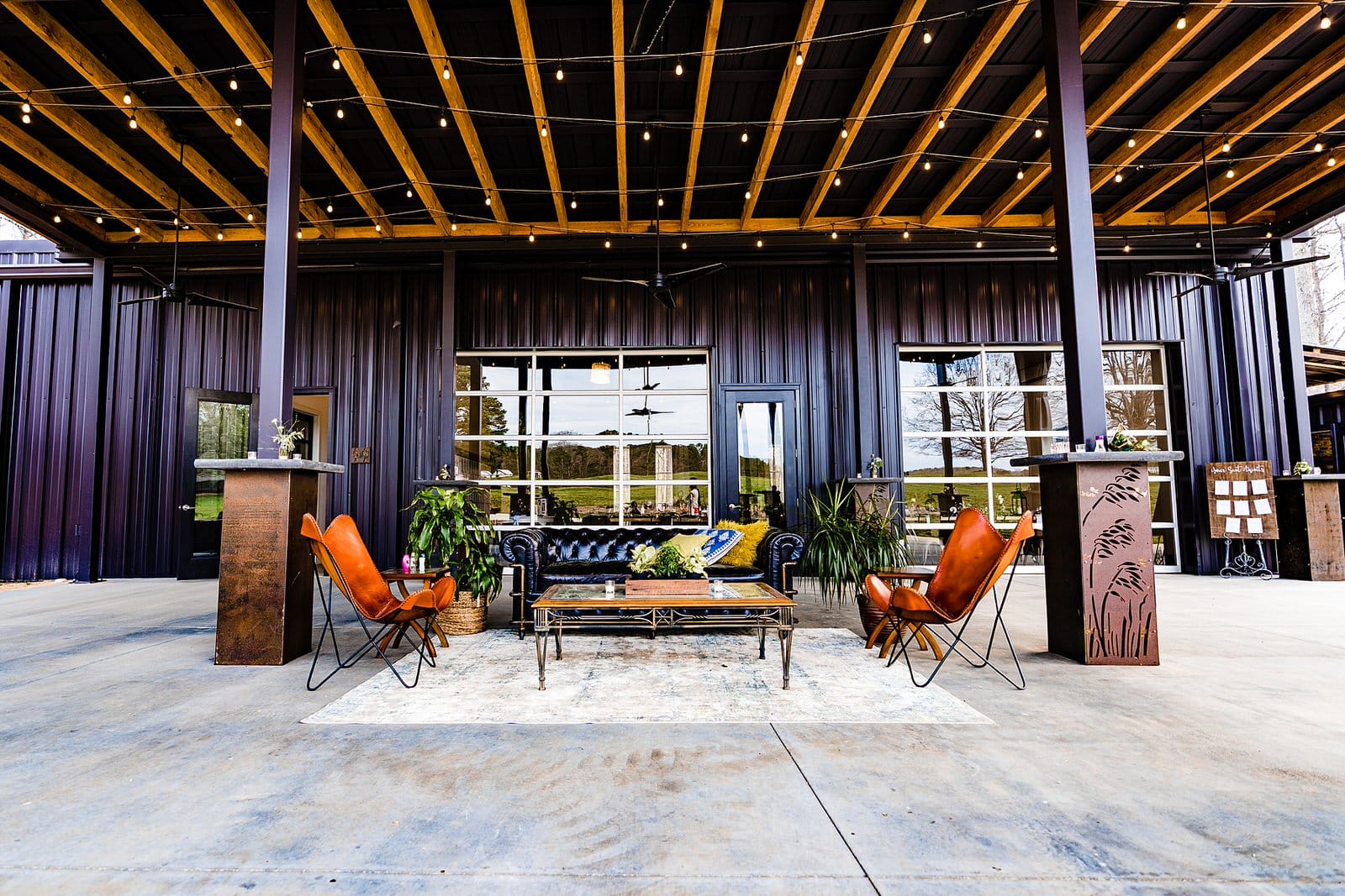 Heron Hall at the Meadows Raleigh set up with outdoor lounges for a wedding at The Meadows Raleigh