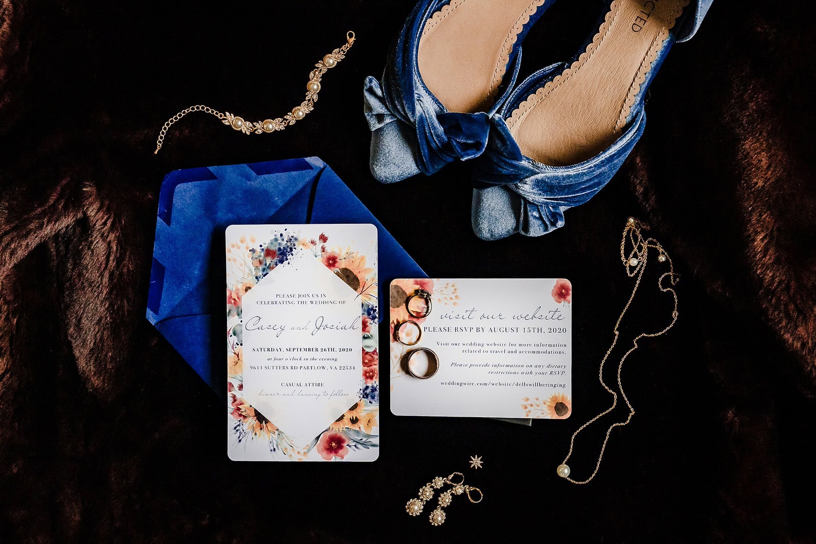 Blue and floral wedding details: invitation suite, blue wedding shoes, jewelry