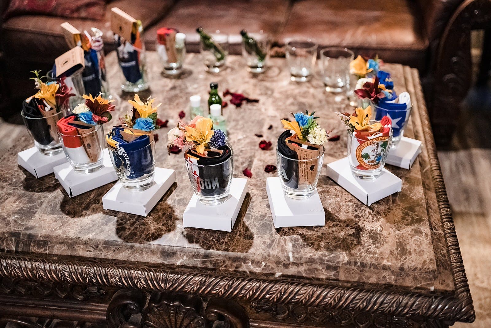 Groomsmen gifts including socks, flasks, and old fashioned glasses