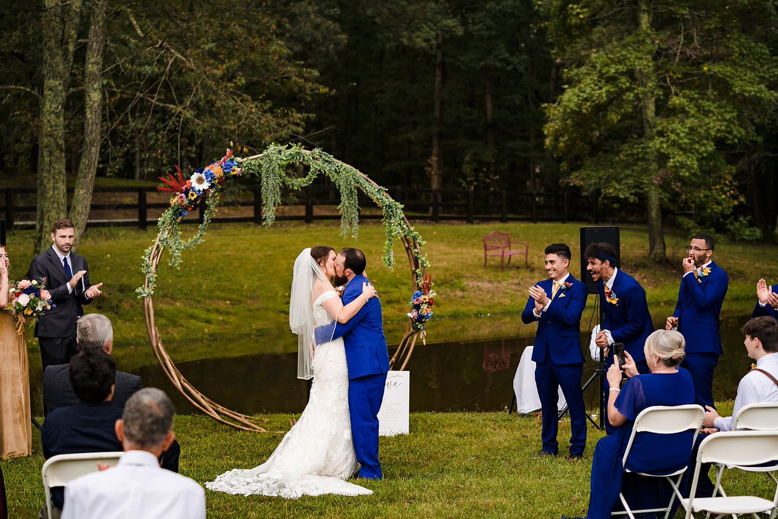 First kiss at DIY farm wedding ceremony