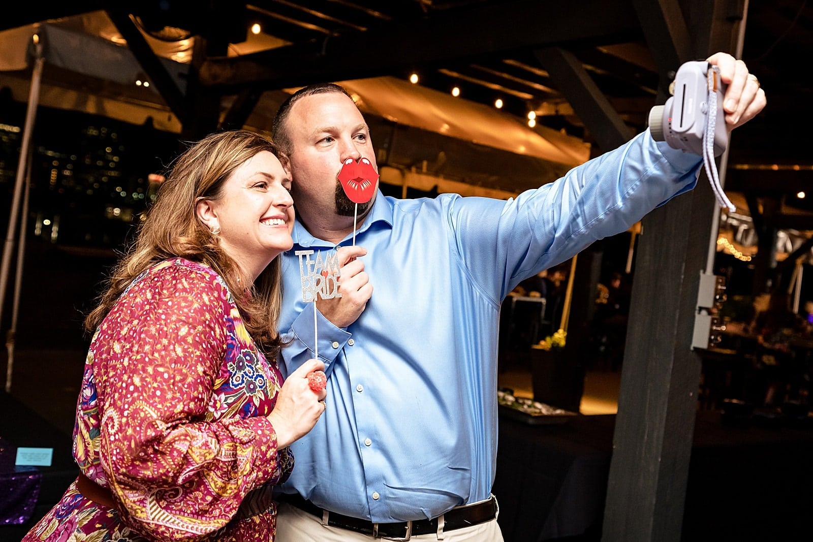 a photobooth is a great addition to your wedding