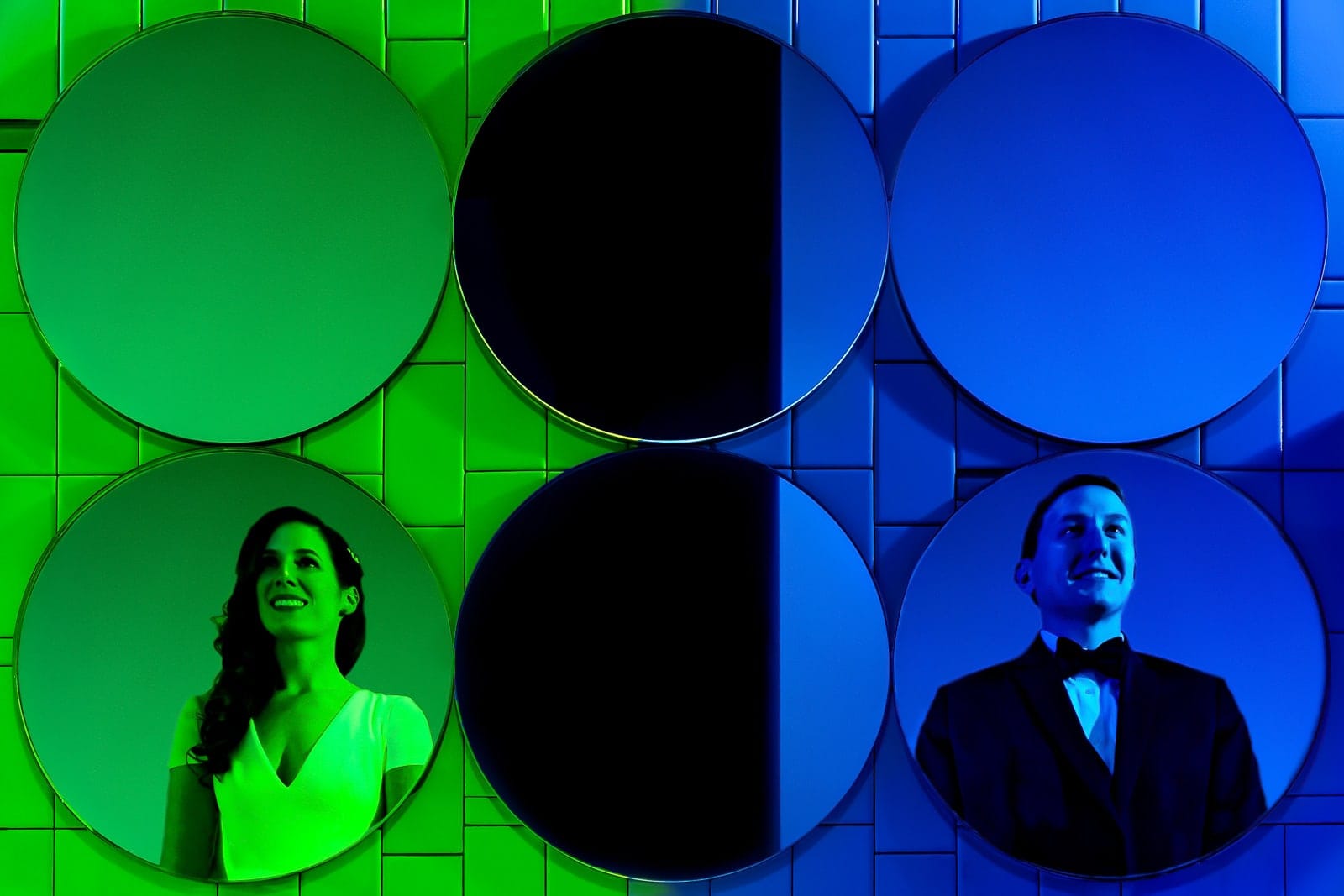 colorful and creative photo of a couple in wedding attire reflected in a set of circular mirrors at a wedding in Durham, NC | photo by Kivus & Camera