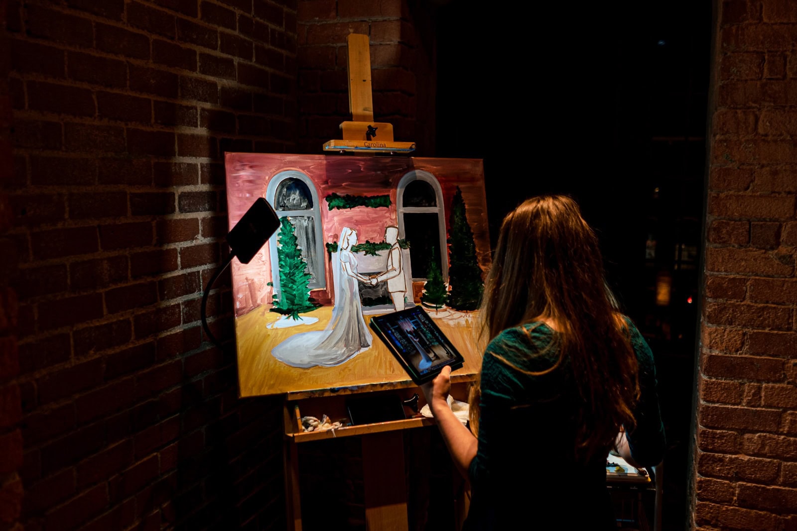 want to splurge on something for your wedding? Consider a live painter! This is Annie Flood from A Stroke of Whimsy and she's awesome! | photo by Kivus & Camera