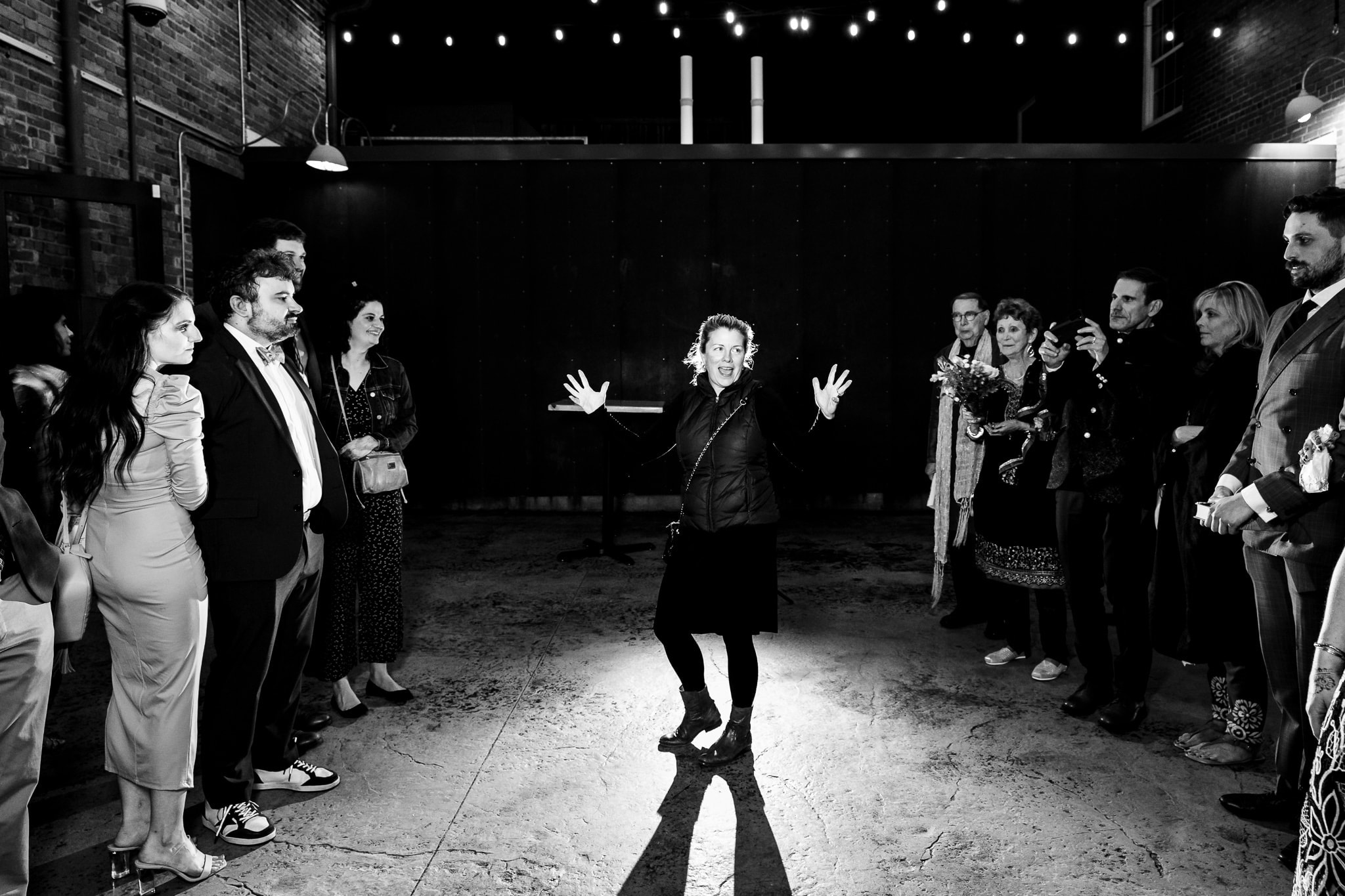 Amanda from A Swanky Affair instructs wedding guests before a sparkler exit. A Swanky Affair is one of the best NCWedding Planners. | photo by Kivus & Camera