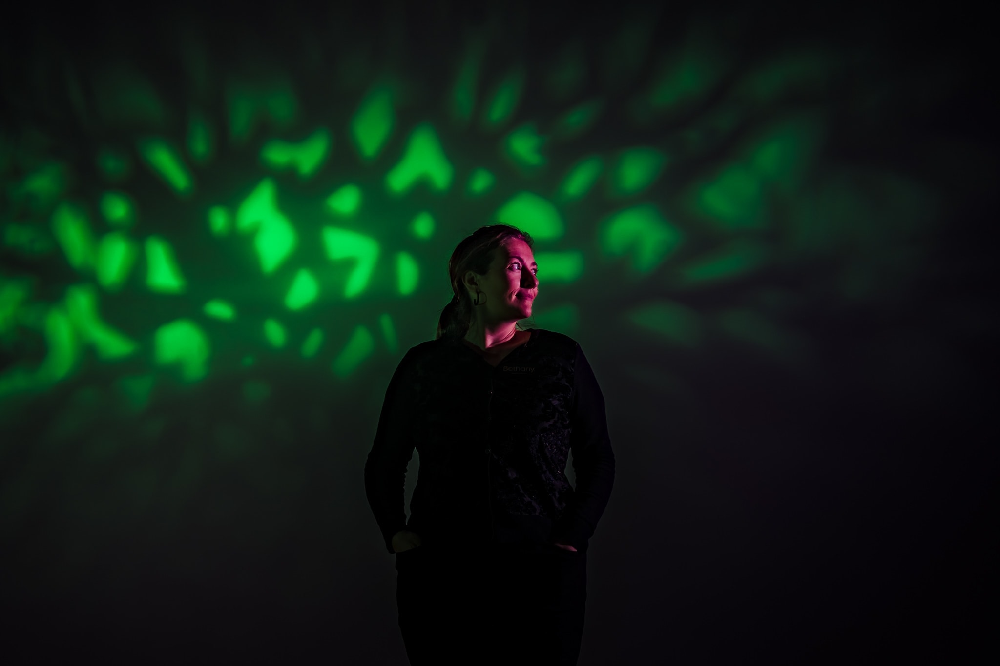 Bethany from Harmony Weddings & Events poses for a dramatic and colorful portrait. Harmony Weddings is one of the best Raleigh Wedding Planners. | photo by Kivus & Camera