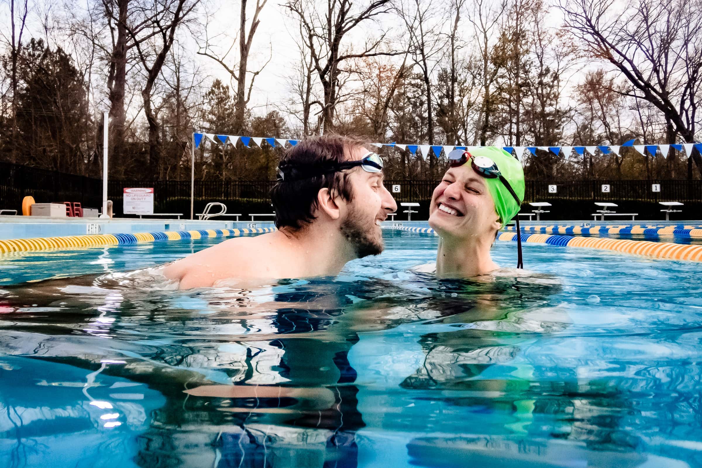 Love to swim? Jump in for a swimming pool engagement photo session | photos by Kivus & Camera