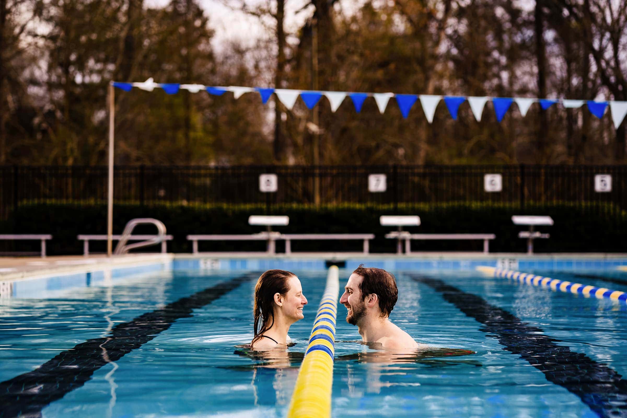 Love to swim? Jump in for a swimming pool engagement photo session | photos by Kivus & Camera
