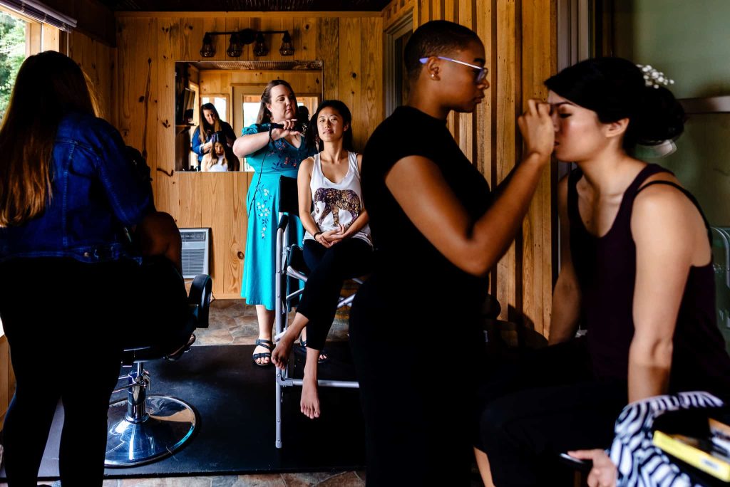 Raleigh wedding hair and makeup stylists from the Wedded Kiss team style a bride and two of her bridesmaids | photo by Kivus & Camera
