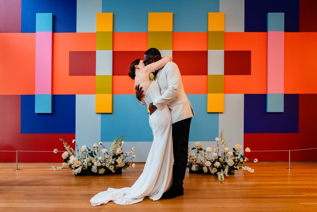 interracial shares their first kiss during their wedding ceremony