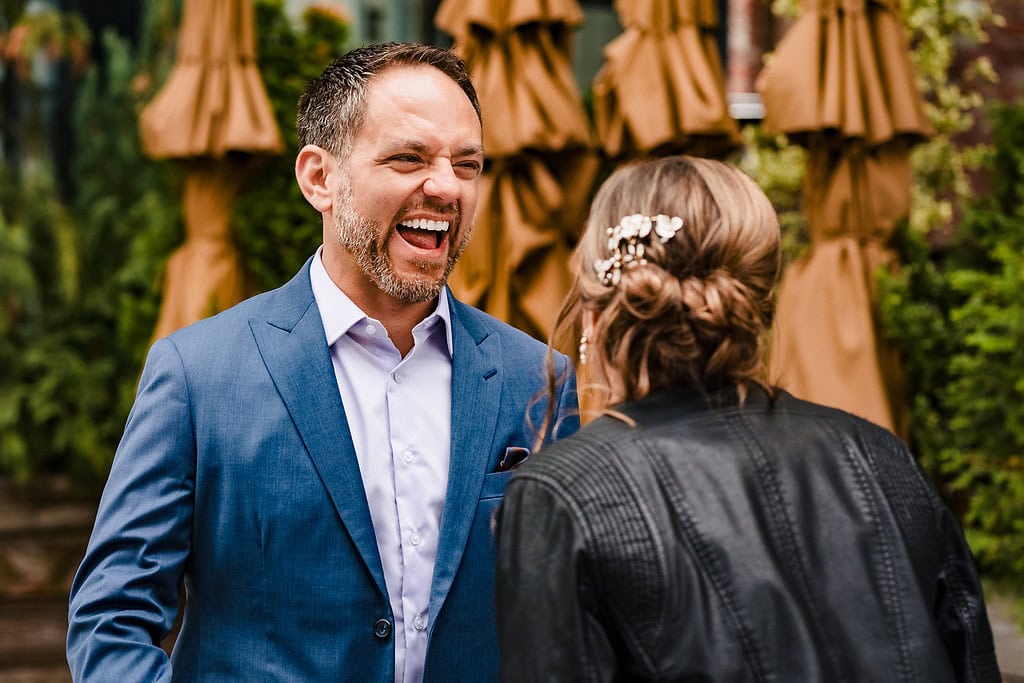 groom reacts to bride's appearance at first look