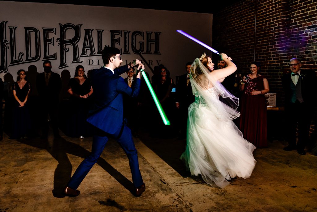 Olde Raleigh Distillery wedding reception - light saber battle instead of first dance at wedding