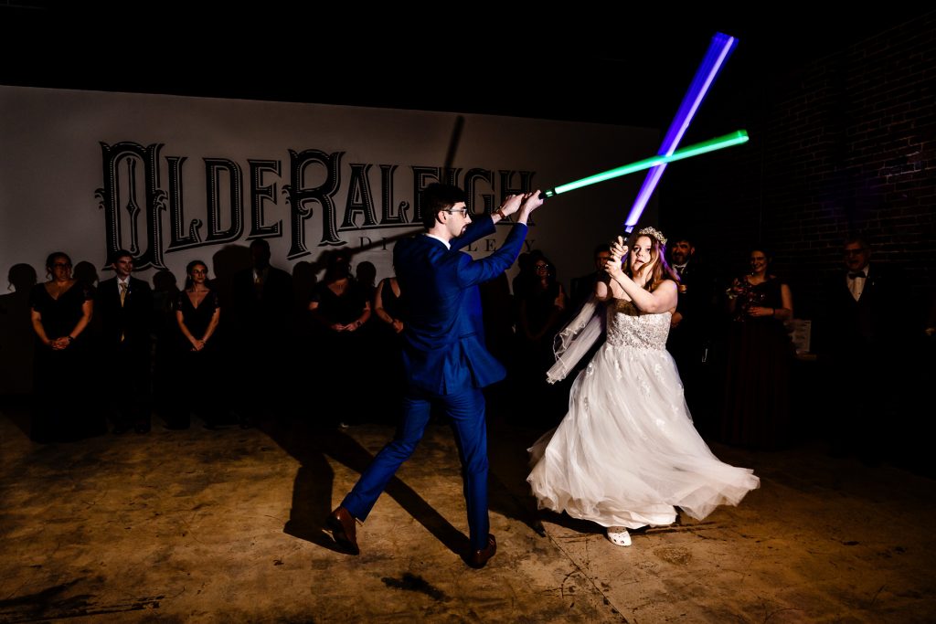 Olde Raleigh Distillery wedding reception - light saber battle instead of first dance at wedding
