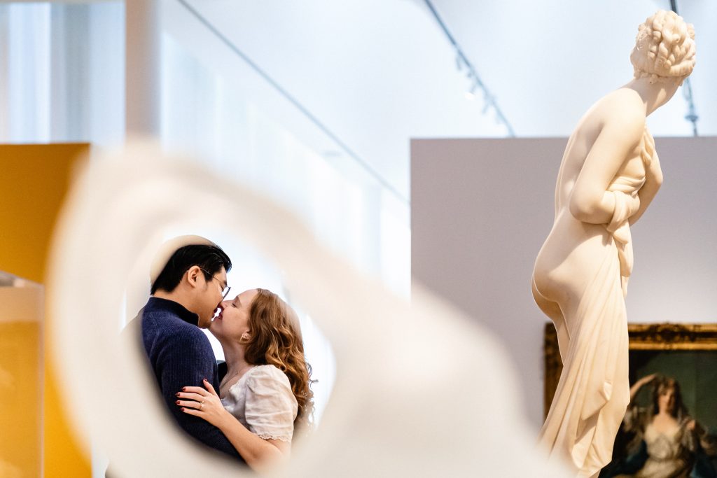 engagement photo of a couple at an art museum | photo by Kivus & Camera