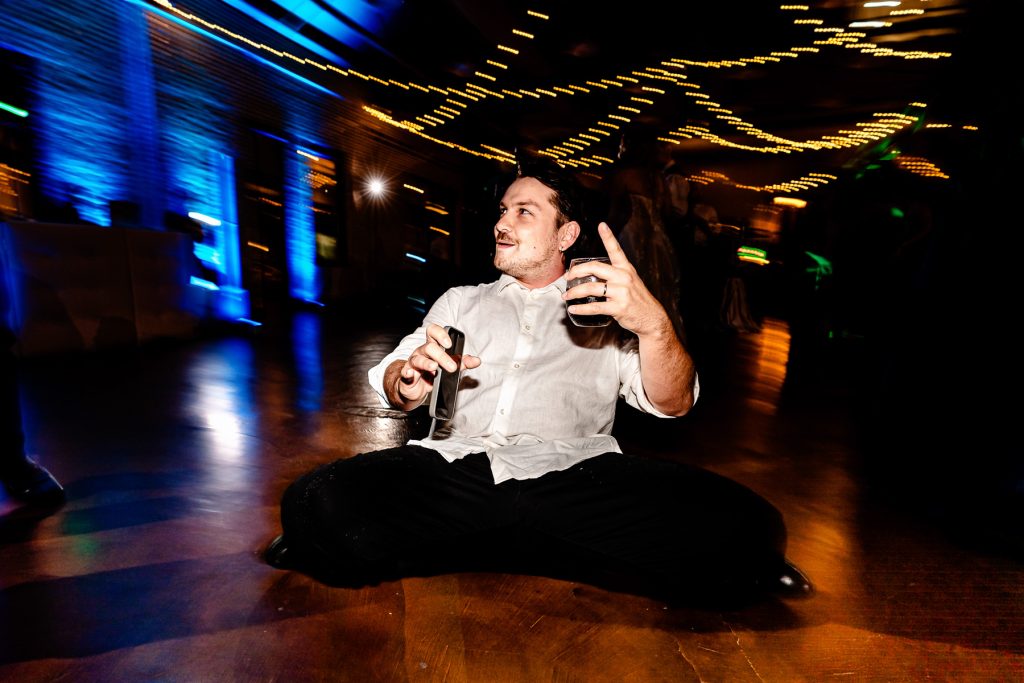 wedding guest gets low on the dance floor at the reception