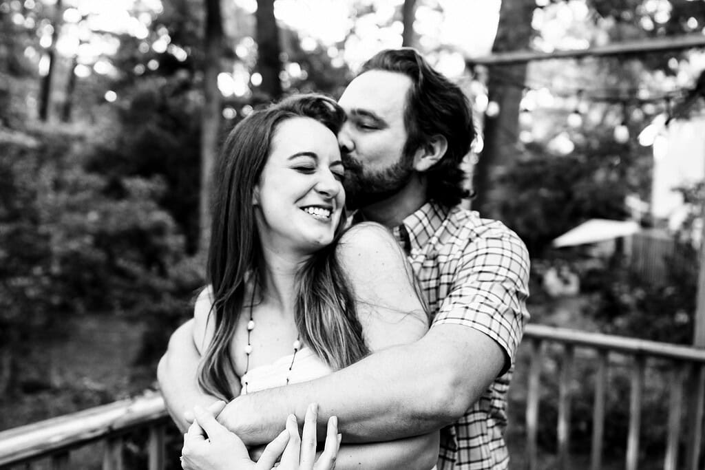 man and woman embracing and laughing