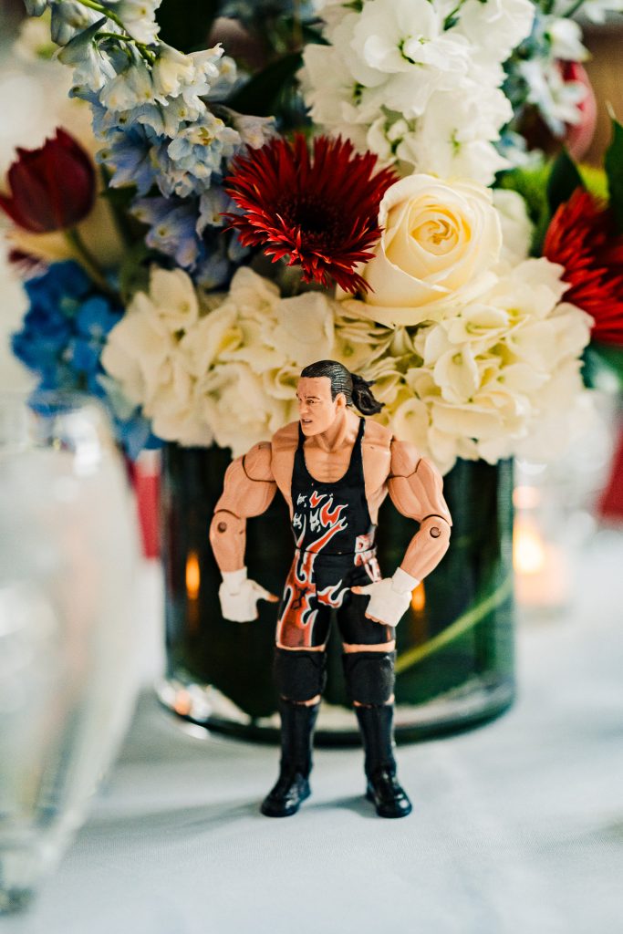 WWE wrestler action figure decorating a table at a wrestling fan wedding reception | photo by Kivus & Camera