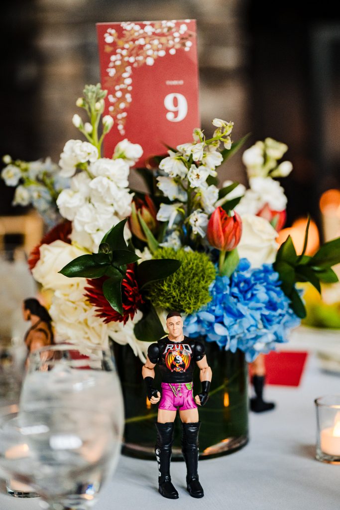 WWE wrestler action figure decorating a table at a wrestling fan wedding reception | photo by Kivus & Camera