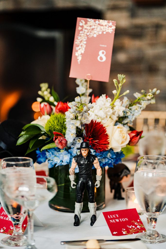 WWE wrestler action figure decorating a table at a wrestling fan wedding reception | photo by Kivus & Camera